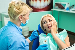 Woman in dental care at emergency dentist.