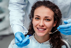 young woman smiling at appointment with sedation dentist in Wharton 