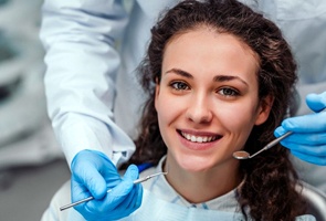 woman in dental chair smiling